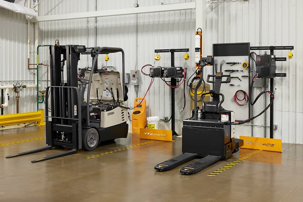 Forklift and pallet truck in the training and charging bay